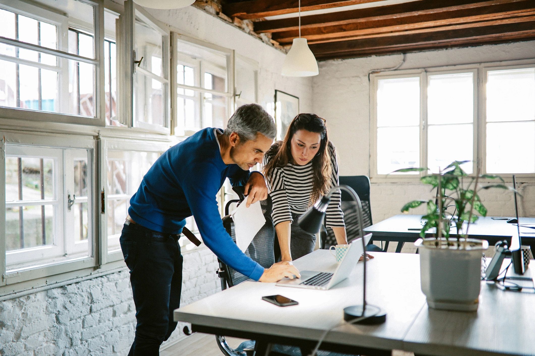 Accounting professionals collaborating in a modern office
